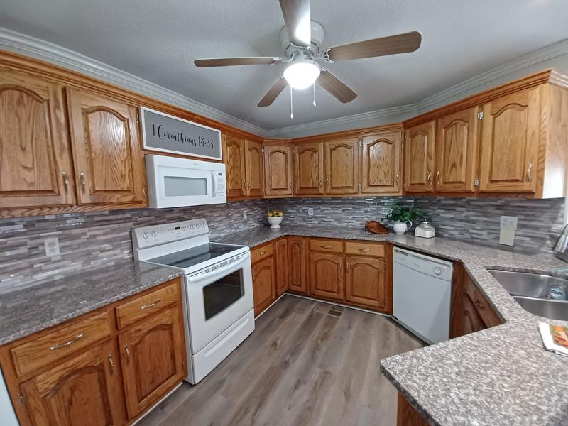 Dated oak kitchen before remodeling work began