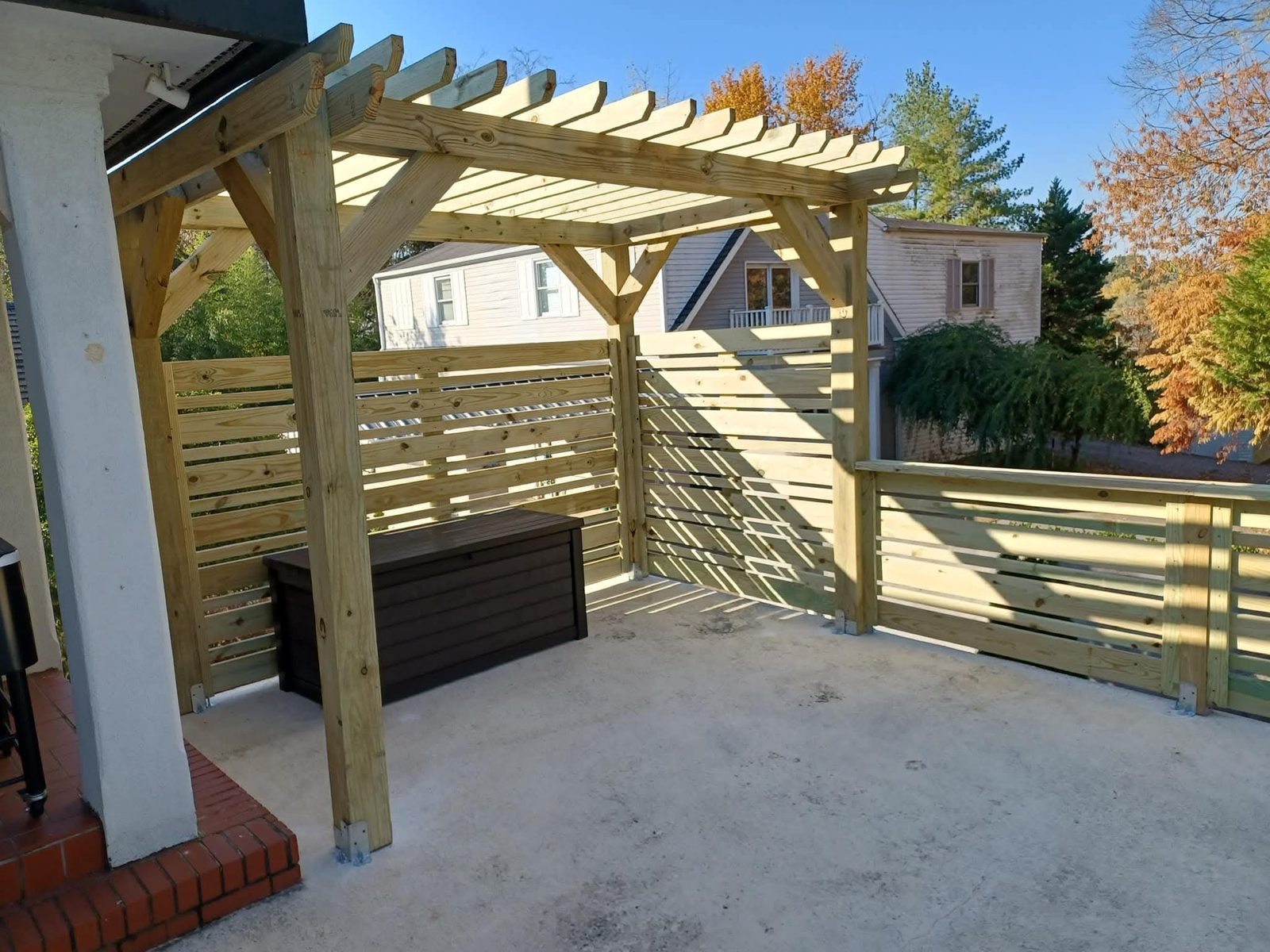 Custom cedar pergola and patio built by DMB Construction